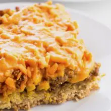 A close-up of a slice of vegan biscuit breakfast casserole.