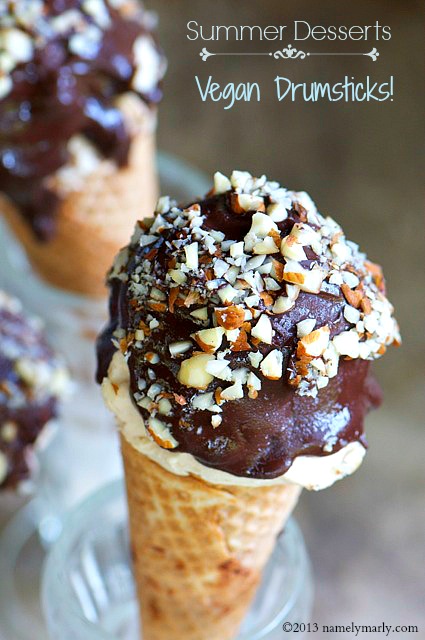 A vegan chocolate drumsticks ice cream treat is sitting in a glass with another one behind it. The text on the page reads, "Vegan Drumsticks."