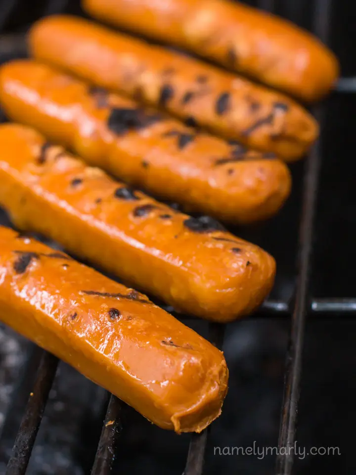 Close up of vegan hot dogs on a grill