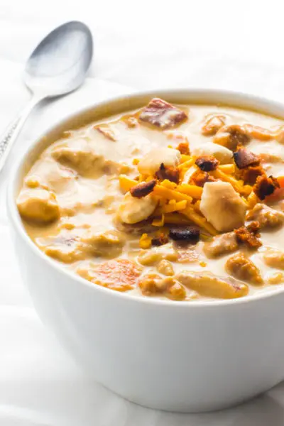Take a bite out of this delicious Vegan Cheeseburger Soup recipe and come back for more. It's a creamy soup made with cashews, potatoes, carrots, and cheese. A perfect weeknight meal.