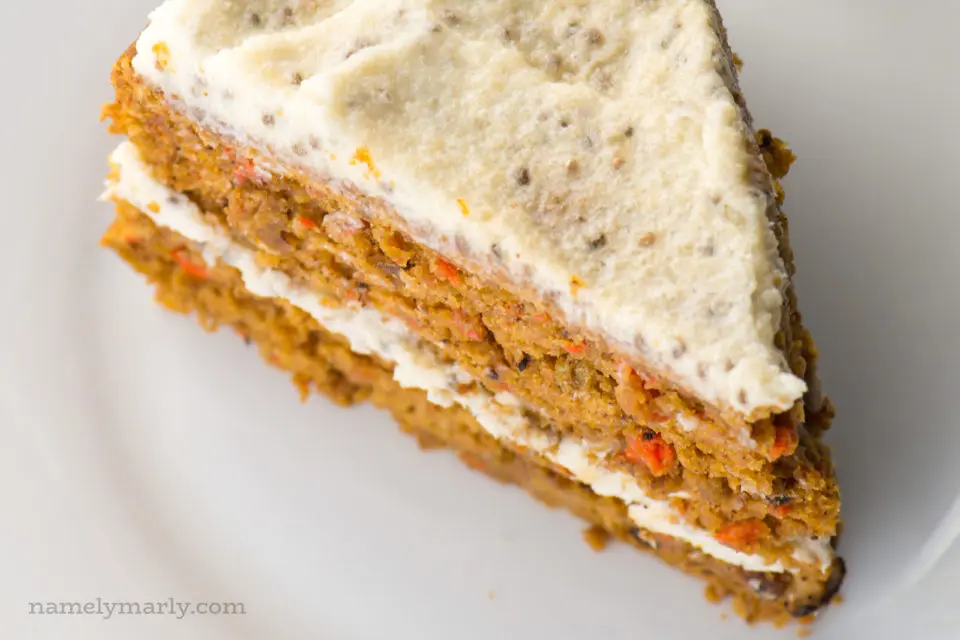 Looking down on a slice of layered carrot cake.