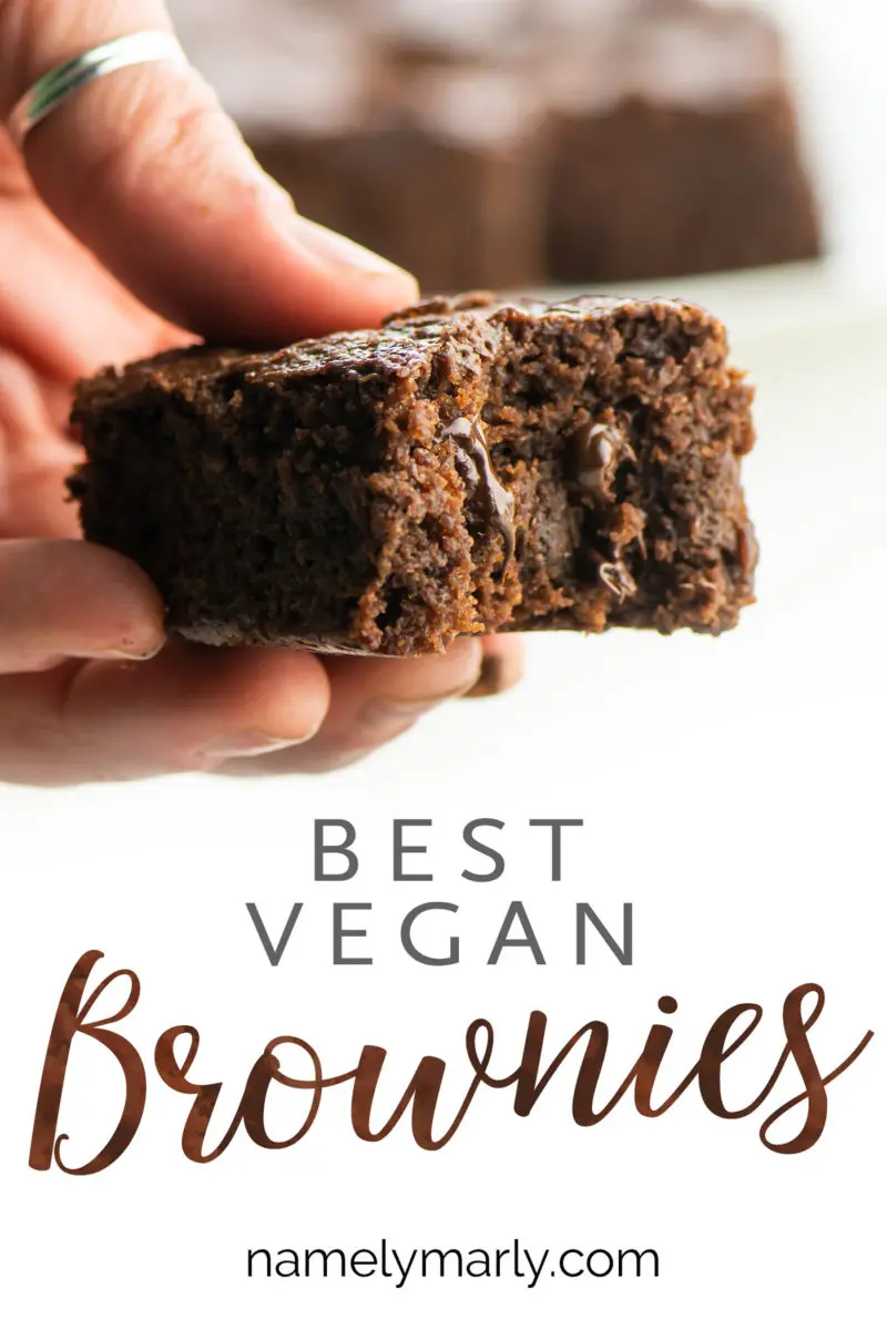 A hand holds a brownie with a bite taken out, the text below it reads: Best Vegan Brownies.