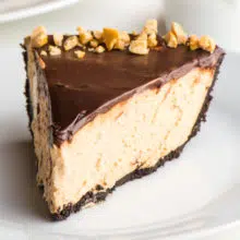 A slice of peanut butter pie sits on a plate.