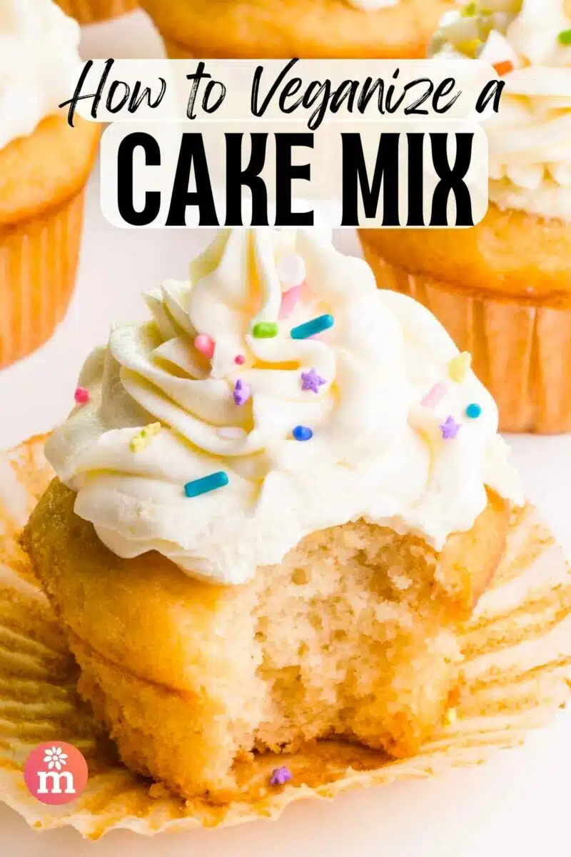 A cupcake has a bite taken out. The text reads, How to Veganize a Cake Mix.