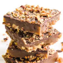 A stack of vegan toffee sits on a white countertop.