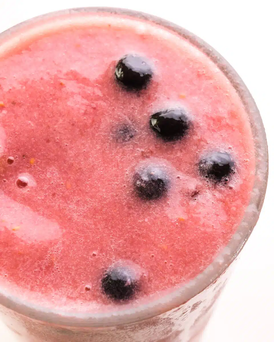 Looking down on a berry smoothie with boba Perls on top.