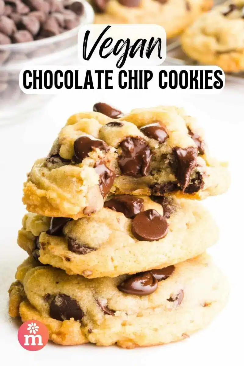 A stack of cookie shows the top one with a bite taken out. The text reads, Vegan Chocolate Chip Cookies.