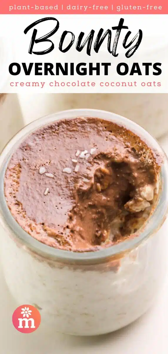 Looking down on a jar of overnight oats with chocolate topping and a bite taken out. The text reads, plant-based, dairy-free, gluten-free Bounty Overnight Oats: creamy chocolate coconut oats.